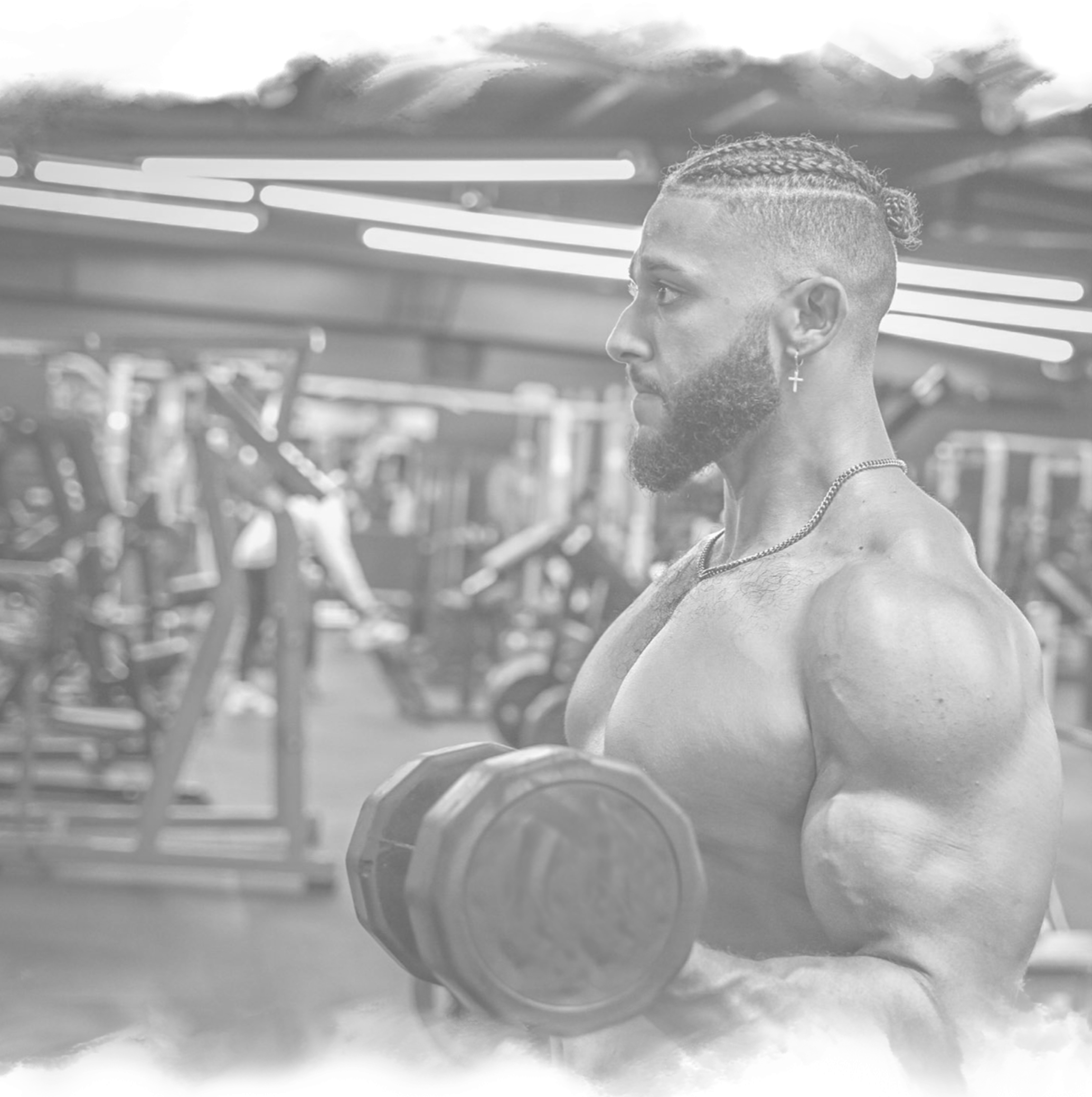 a man lifting dumbbells in the gym